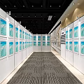Art Exhibition Hall With White Panels Displaying Blue Paintings Under Bright Lighting And Carpet