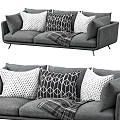 Gray Three Seater Sofa With Geometric Polka Dot Pillows And Plaid Throw 3d model