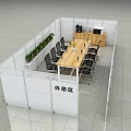 Modern Partitioned Break Room Lounge Area With Long Wooden Table Black Chairs And Green Plants