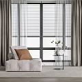 Light Gray Bean Bag Chair With Brown Cushion By Window And Gray Curtains
