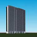 Modern High Rise Building With Glass Facade On Green Lawn And Blue Sky