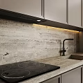 Modern Kitchen Interior With Beige Cabinets Built In Lighting And Stone Countertop