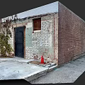 Concrete Floor Tiles Outside Red Brick Building With Black Door Green Vines Red Traffic Cone