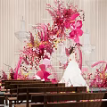Floral Installation With Pink Red Yellow Flowers Hanging Arrangements And Transparent Structures