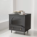 Black Bedside Table with Gold Knobs Drawer Topped with Open Book White Cup on Tray 3d model