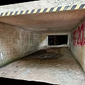 Dilapidated Concrete Tunnel Interior With Graffiti Yellow Black Striped Tape And Dirt Floor 3d model