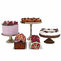 Assorted Desserts On Stands With Purple Cake Cupcakes Fruit Topped Loaf And Swiss Roll