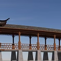 Traditional Chinese Garden Landscape With Wooden Veranda Tiled Roof Carved Railings And Blue Sky Background