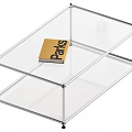 Modern Coffee Table with Transparent Glass Top Metal Frame and Parks Book on Surface