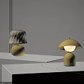 Two Minimalist Table Lamps With Beige And Yellow Shades Yellow Bases On White Display Stands