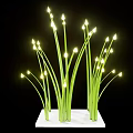 Decorative Ornament Set With Green Grass Like Stems And Small Yellow Lights On White Base