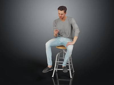 Man In Gray Shirt And Light Blue Jeans Sitting On Bar Stool Holding Smartphone 3d model