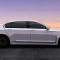 Elegant White Luxury Sedan With Black Rims On Gray Ground During Sunset
