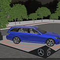 Blue Mercedes-Benz Car on Illuminated Display Platform With Stage Lights And Background Trees