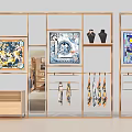 Elegant Display Space With Golden Frame Racks Colorful Scarves Decorative Paintings And Black Vases