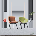 Orange and Green Accent Chairs with Black Legs in Modern Interior with Plants and Decorations