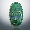 Green Decorative Mask With Textured Surface And Blue Eyes Serrated Edges