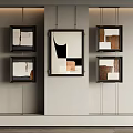 Modern Abstract Art Paintings In Black Frames On Light Colored Wall