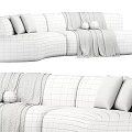 Curved Sectional Multi Person Sofa In Brown Gray Plush Material With Decorative Pillows And Throw Blanket