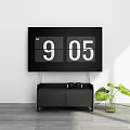 Large Digital Clock On White Wall With Black TV Stand And Green Plant In Vase