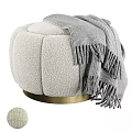 Plush Ivory Bouclé Fabric Ottoman With Gold Metal Base and Soft Gray Throw Blanket