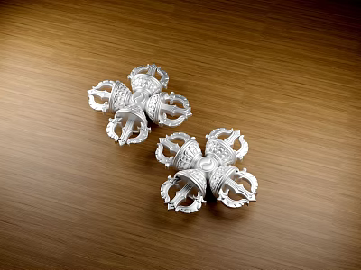 Two Ancient Silver Spiked Weapon Parts With Intricate Design On Wooden Surface 3d model