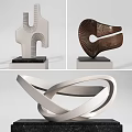 Contemporary Artistic Sculptures Featuring Various Curved Metallic Lines And Shapes