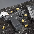 Various Handguns And Bullets Placed On Black Surface With Star Patterns