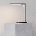Modern Desk Lamp With Aluminum Pole Black Base Simple Design On Table Against White Wall