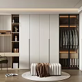 Modern Walk in Closet Interior With Glass Door Cabinets Displayed Clothes Bench And Desk Area