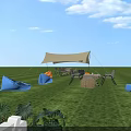 Outdoor Camping Tent With Wooden Food Counter And Colorful Mats On Lawn