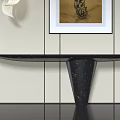 Foyer Hallway Interior With Black Console Table And Framed Artwork On Light Colored Walls