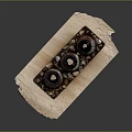 Three Decorative Candle Holders Arranged on Wooden Tray with Small Pebbles