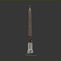 Tall Brown Obelisk Structure With White Stone Pedestal And Golden Top Decoration