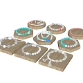 Various Jewelry Pieces Including Bracelets And Necklaces On Wooden Trays With Colorful Beads