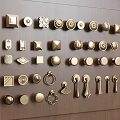 Assorted Decorative Cabinet Handles in Various Shapes and Metal Finishes on Wooden Panel