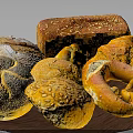 Assorted Breads with Crusty Loaves Croissants and Pretzels on Wooden Platter