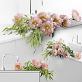 Elegant Pink Peonies With Green Leaves In Glass Vase On White Countertop