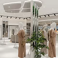 Modern Clothing Store Window Display With Dressed Mannequins Green Plants And Bright Lighting