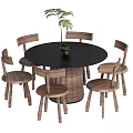 Round Black Dining Table Set With Six Wooden Chairs And Woven Seats Plus Potted Plant