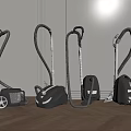Different Types of Vacuum Cleaners in Black and Gray on Wooden Floor
