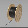 High Quality Wooden Spool With Black Wound Wire And Natural Wood Grain Texture