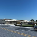 Modern Industrial Warehouse Exterior Design With Parking Lot Vehicles Trees And Entrance