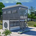 Two Story Container Building With Balcony White Railings And Staircase In Green Environment