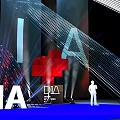 DIA Event Scene With Radial Lines Purple Blue Background And Human Figure Standee