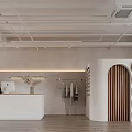 Modern Minimalist Clothing Store Interior With White Reception Wooden Hangers Curved Door And Light Flooring