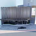 Modern Commercial Building Exterior With Curved Striped Facade And Glass Entrance Design
