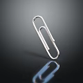 Shiny Silver Metallic Paperclip Standing On Black Background With Reflection 3d model