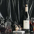 Elegant Wine Bottle And Glass With Crystal Decanter Metal Ornament And Apples On Black Velvet