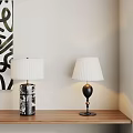 Two Stylish Table Lamps On Wooden Shelf With White Pleated Shades And Abstract Art